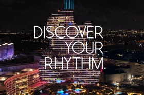 the Hard Rock Guitar Hotel in Hollywood, FL with words Discover your Rhythm text overlaid the image.